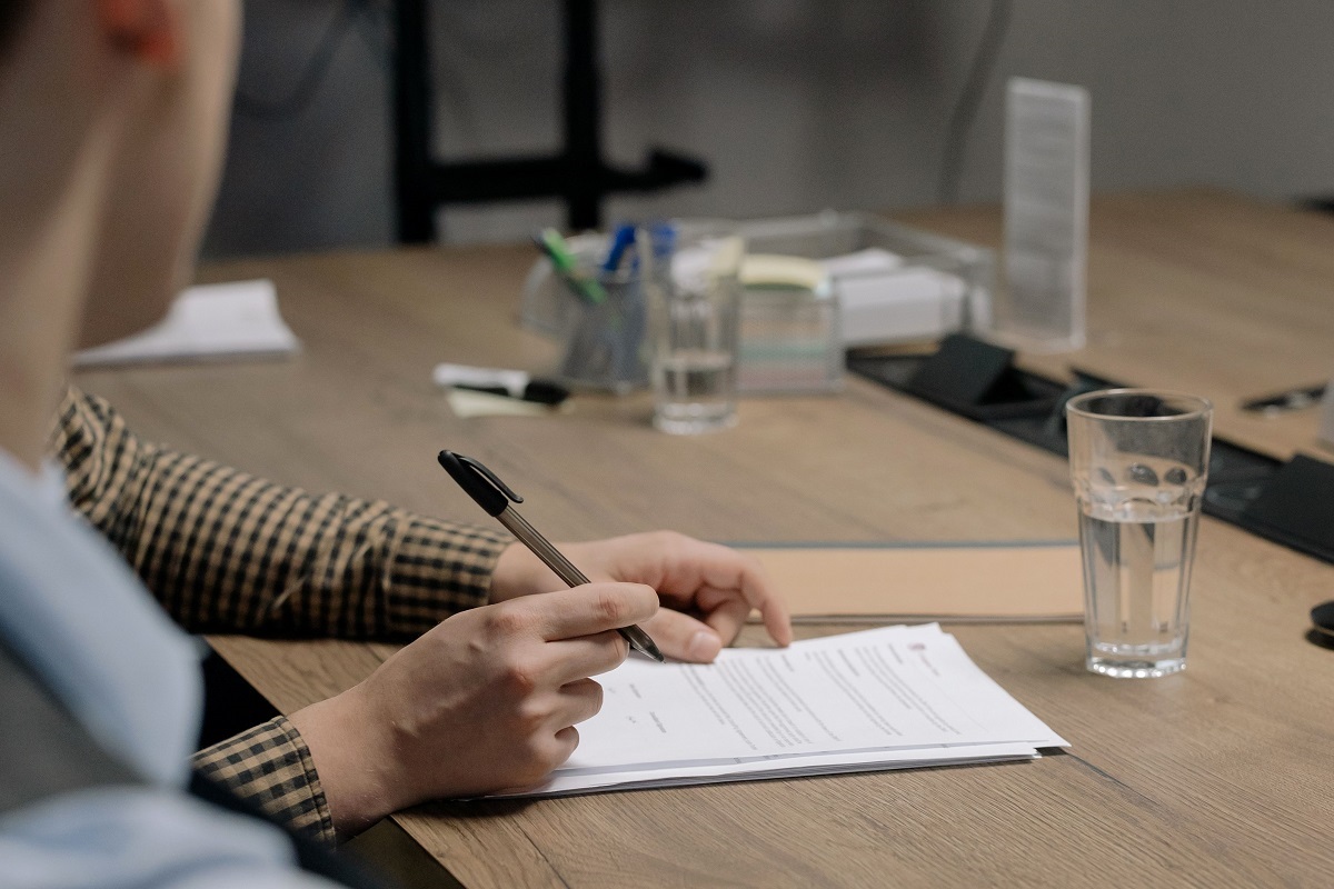 Employee working on a side business at home in the evening while self-employed