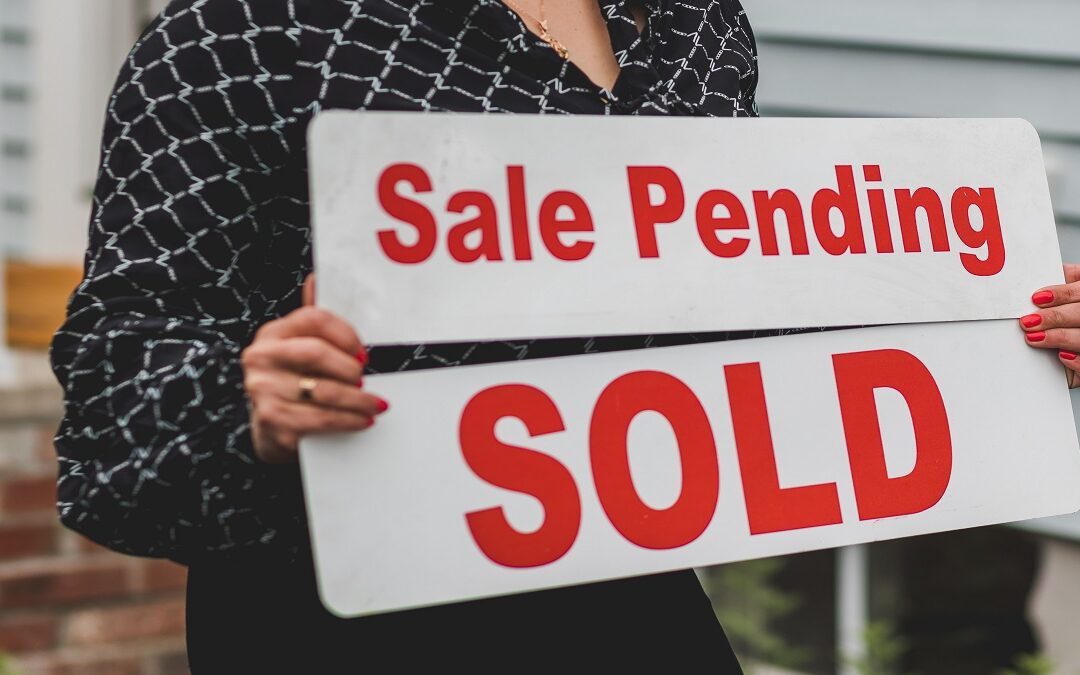 Capital gains tax on property: UK house with a sold sign outside